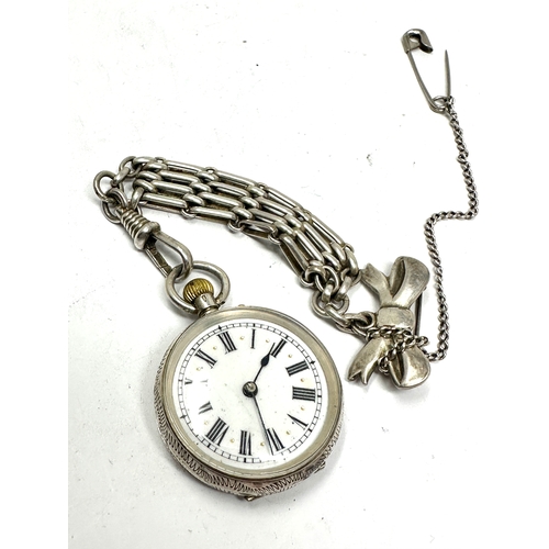 449 - Antique silver fob watch and chain the watch is ticking