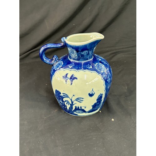 112 - Oriental blue and white jug, makers mark to base, overall good condition, approximate height 8 inche... 