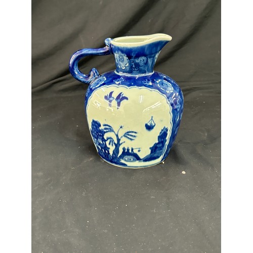 112 - Oriental blue and white jug, makers mark to base, overall good condition, approximate height 8 inche... 