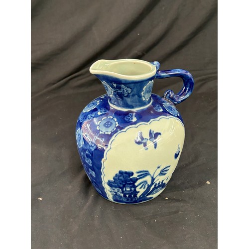 112 - Oriental blue and white jug, makers mark to base, overall good condition, approximate height 8 inche... 