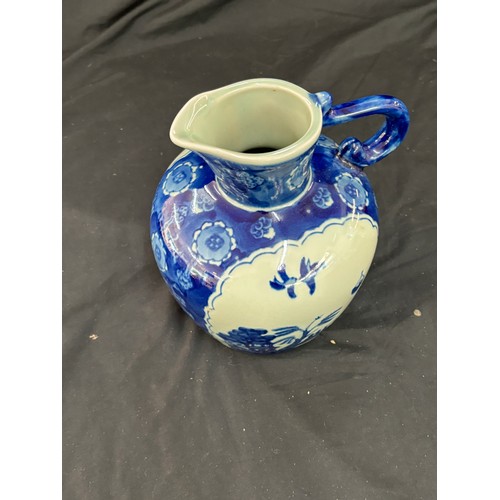 112 - Oriental blue and white jug, makers mark to base, overall good condition, approximate height 8 inche... 