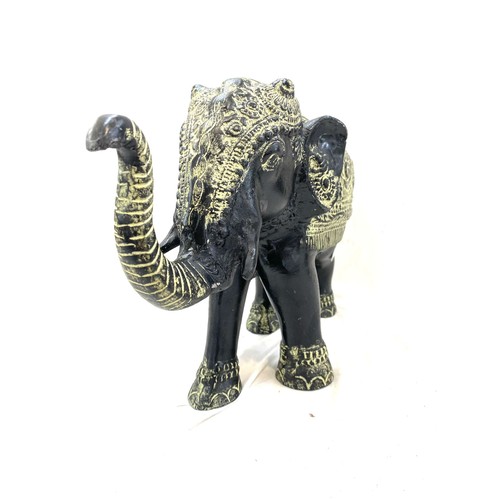 107 - Cast iron elephant ornament measures approx 11.5 inches tall by 16.5 inches wide
