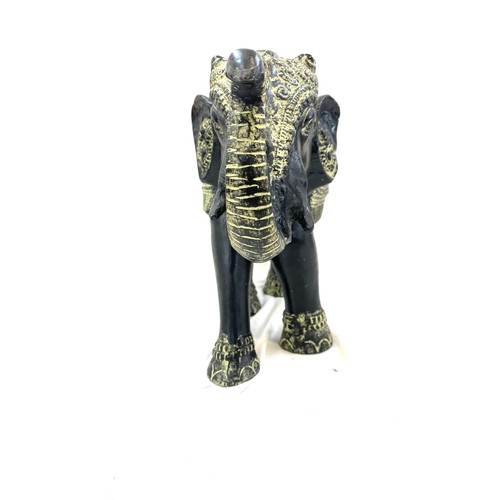107 - Cast iron elephant ornament measures approx 11.5 inches tall by 16.5 inches wide