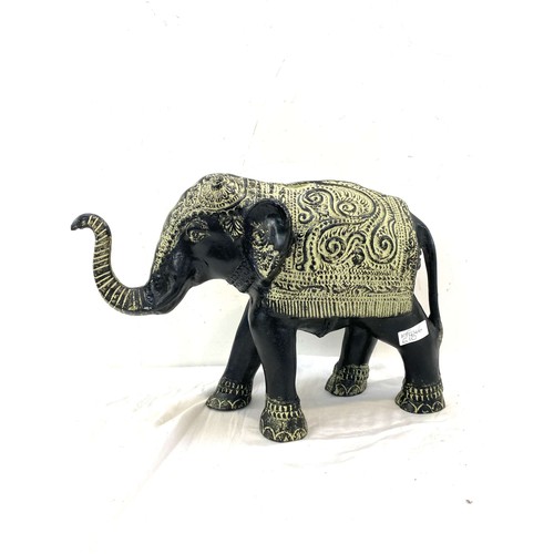 107 - Cast iron elephant ornament measures approx 11.5 inches tall by 16.5 inches wide