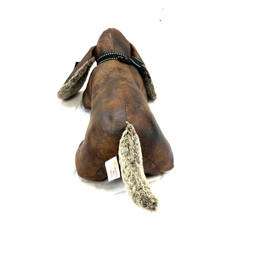 59 - Lesser and Pavey novelty dog door stop measures approx 6 inches tall by 17 inches wide