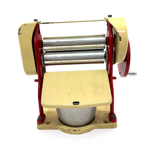 106 - Vintage Knights head tin plate die cast mangle