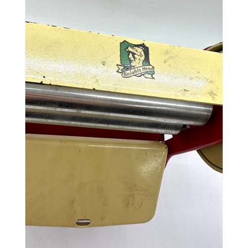 106 - Vintage Knights head tin plate die cast mangle