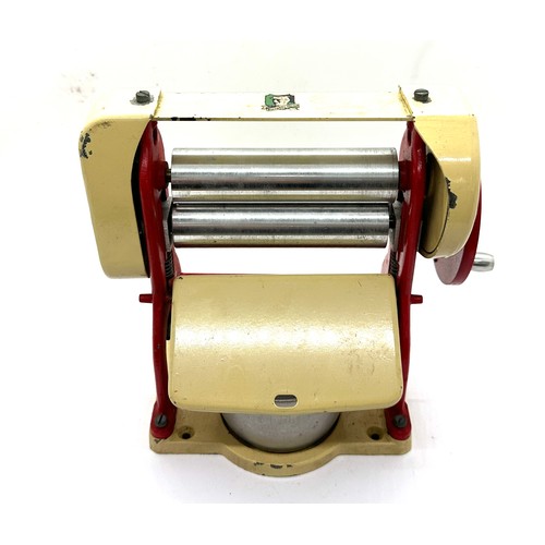 106 - Vintage Knights head tin plate die cast mangle