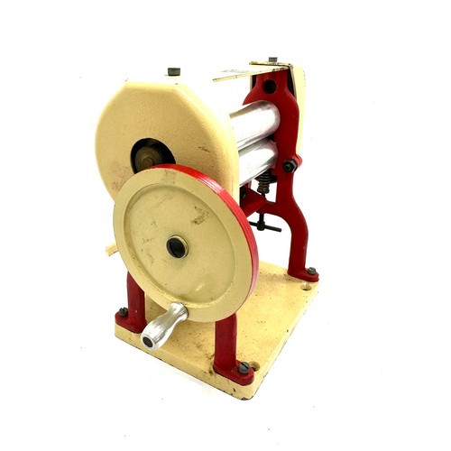 106 - Vintage Knights head tin plate die cast mangle