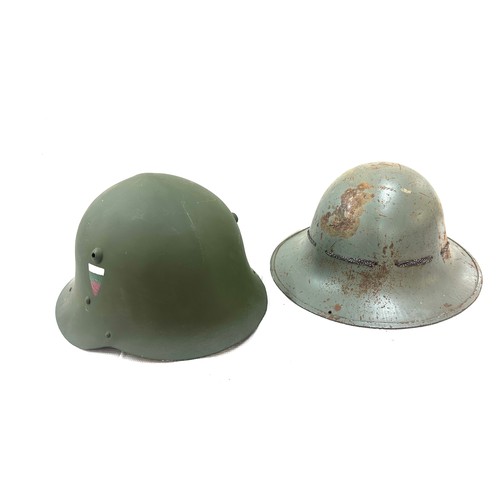 70A - Two military style helmets