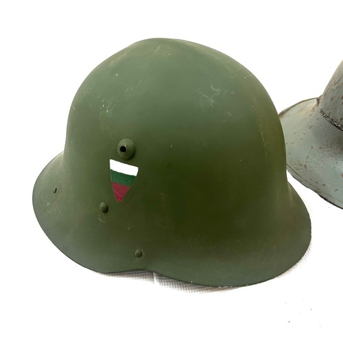 70A - Two military style helmets