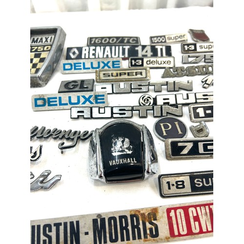 37 - Large selection vintage car brand and model badges