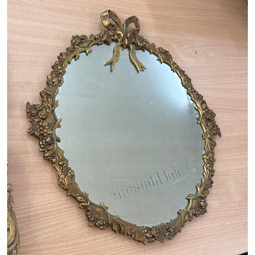 20 - Gilt framed ornate oval mirror resin gilt style wall mirror, approximate measurements of largest 22 ... 