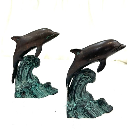 120 - Two metal bronze style dolphins measures approx 7 inches tall