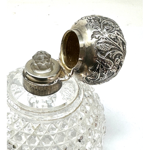 74 - Large antique silver top & cut glass perfume bottle measures approx height 15cm diameter 11cm London... 