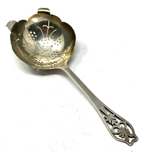 77 - Silver tea strainer spoon sheffield silver hallmarks makers edward viner weight 44g