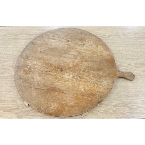 83 - Large rustic pizza board measures approx 26 inches in diameter