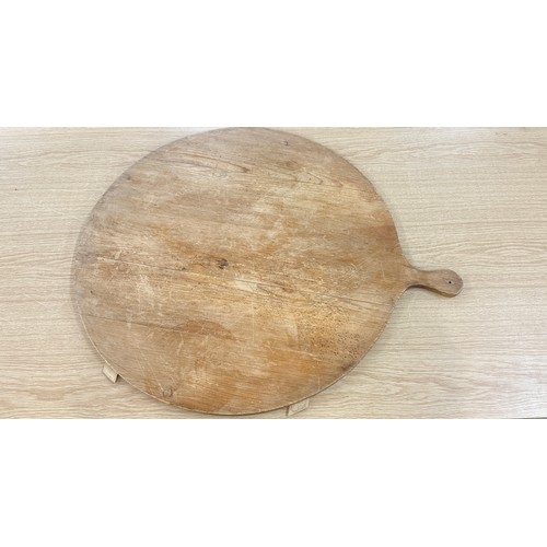 83 - Large rustic pizza board measures approx 26 inches in diameter