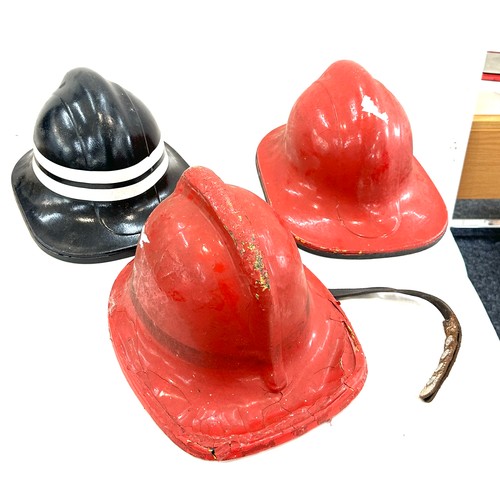 124 - Three vintage fire mans helmets