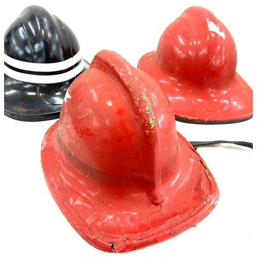 124 - Three vintage fire mans helmets