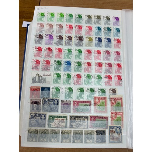 31 - Album containing various loose stamps, multiple countries, denominations