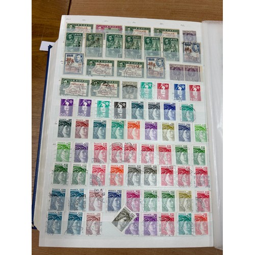 31 - Album containing various loose stamps, multiple countries, denominations