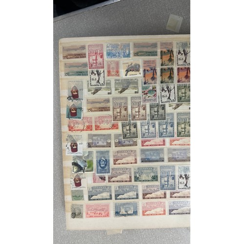 34 - Album containing various loose stamps, multiple countries, denominations