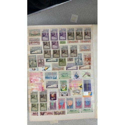 34 - Album containing various loose stamps, multiple countries, denominations