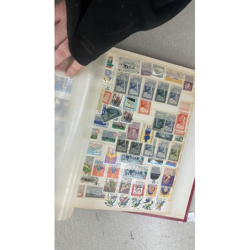 34 - Album containing various loose stamps, multiple countries, denominations