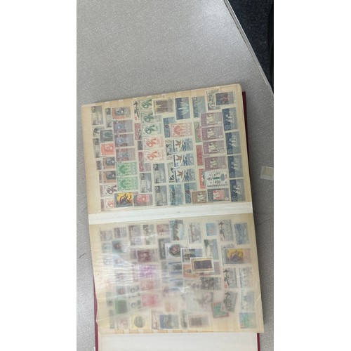 34 - Album containing various loose stamps, multiple countries, denominations