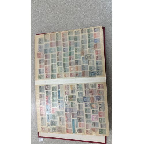 34 - Album containing various loose stamps, multiple countries, denominations