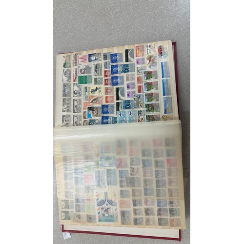 34 - Album containing various loose stamps, multiple countries, denominations