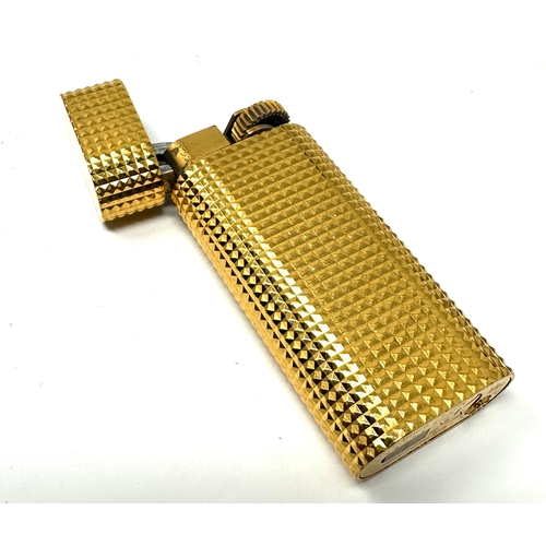 338 - Authentic Cartier Gold plated lighter.  Gold plated with a polished pyramid texture. 
2 .3'' Tall x ... 