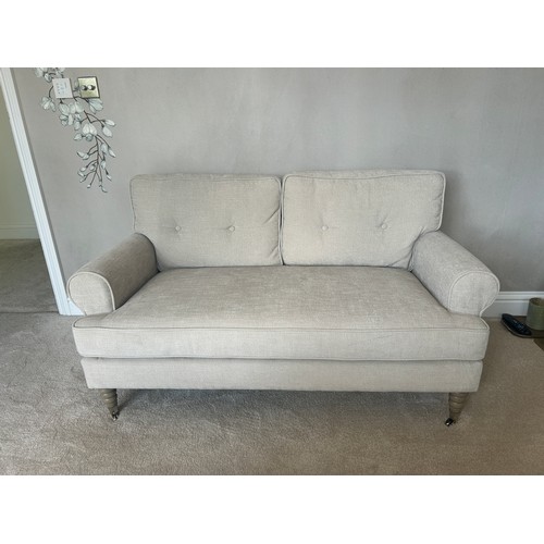 576 - 2 Seater cream modern sofa, approximate measurements: Height 26 inches, Width 56 inches, Depth 33 in... 