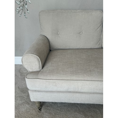 576 - 2 Seater cream modern sofa, approximate measurements: Height 26 inches, Width 56 inches, Depth 33 in... 