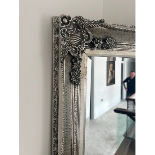 574 - Silver framed ornate hall mirror, approximate measurements: Height 64 inches, Width 31 inches