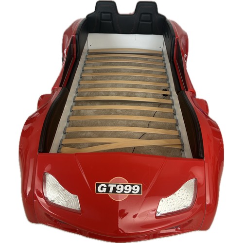 581 - GT999 red childrens car model bed, light up feature with mattress, approximate overall measurements:... 