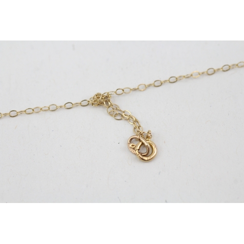 87 - 9ct gold playboy pendant necklace (1.1g)