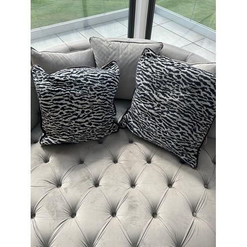 585 - Grey fabric button detail love seat, overall diameter: 56 inches Height 28 inches,