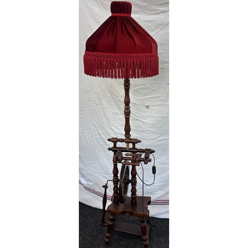 550 - Vintage wooden standard lamp with spinning wheel feature needs rewiring measures approx 62 inches ta... 