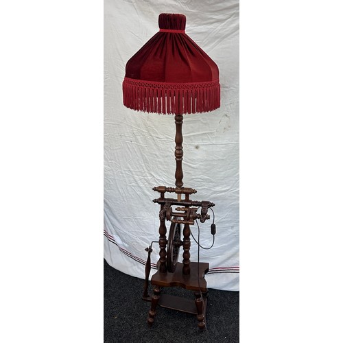 550 - Vintage wooden standard lamp with spinning wheel feature needs rewiring measures approx 62 inches ta... 