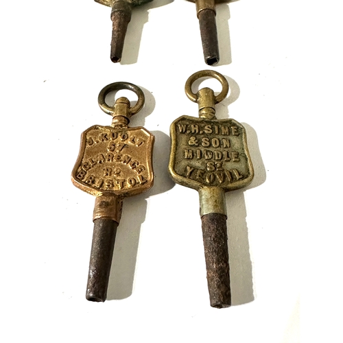 353 - 4 antique  advertising pocket watch keys