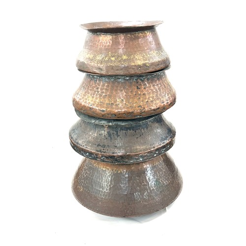 192 - Four Indian copper cooking pots largest measures approx 9 inches tall by 11 inches diameter