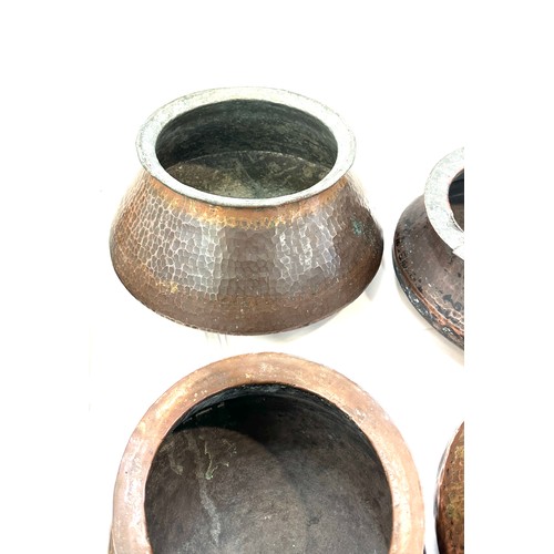 192 - Four Indian copper cooking pots largest measures approx 9 inches tall by 11 inches diameter