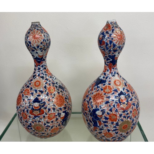 64 - Pair of unusual shaped oriental vases with marks to base overall height 12 inches