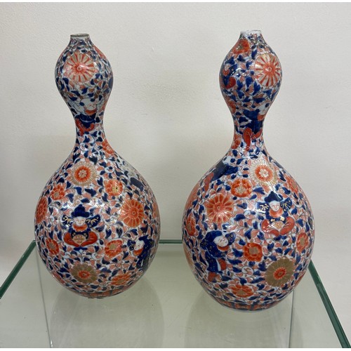 64 - Pair of unusual shaped oriental vases with marks to base overall height 12 inches