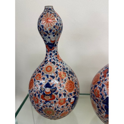 64 - Pair of unusual shaped oriental vases with marks to base overall height 12 inches