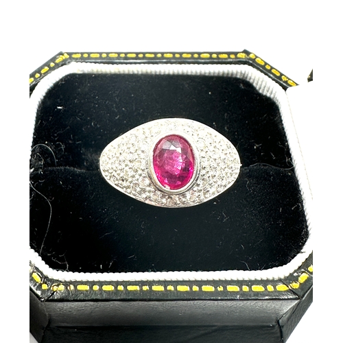 127 - 18ct white gold ruby & diamond ring ruby measures approx 7mm by 5mm set with diamond shoulders weigh... 