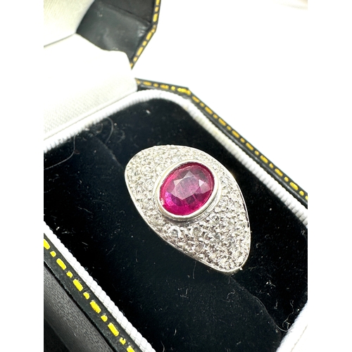 127 - 18ct white gold ruby & diamond ring ruby measures approx 7mm by 5mm set with diamond shoulders weigh... 