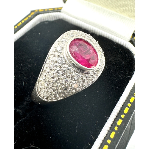 127 - 18ct white gold ruby & diamond ring ruby measures approx 7mm by 5mm set with diamond shoulders weigh... 